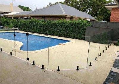 Rectangular galas fencing around a boot shaped swimming pool Glengowrie