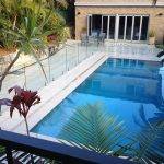 Installing a frameless glass pool fence for a client in Renmark using best quality, australian made, Boresi clamps and spigots