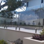 Frameless glass pool fencing with rural views