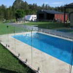 Frameless glass pool fence and blue pool in Adelaide